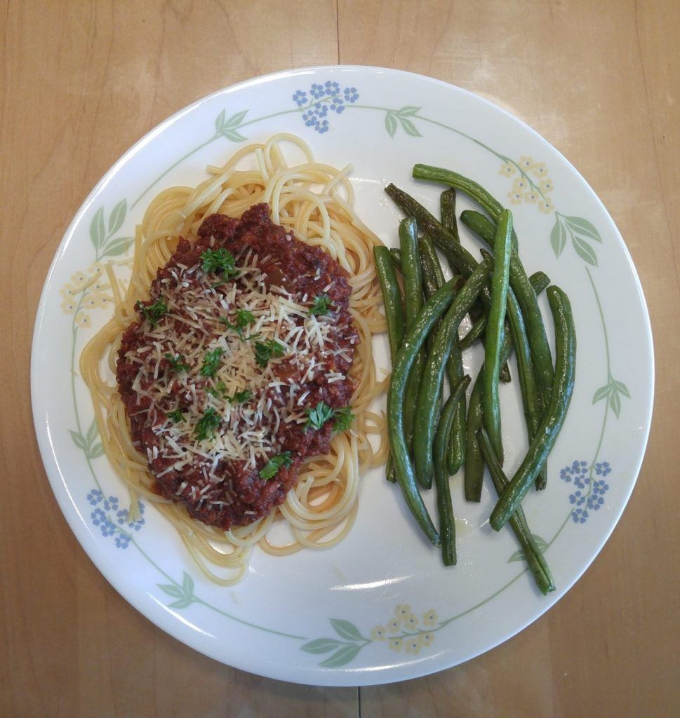 Crock pot spaghetti sauce over noodles and garlic roasted green beans.