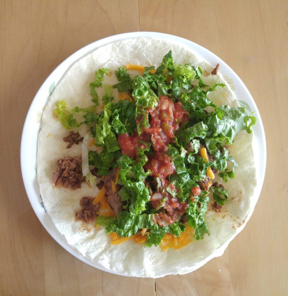 Soft tacos: beans cheese, salsa, lettuce, seasoned ground beef pre-wrapped.
