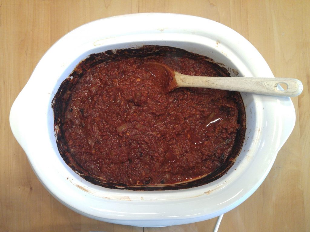 Crockpot spaghetti sauce: meat, tomato paste, tomato puree, onion powder, garlic powder, onions, canned mushrooms.